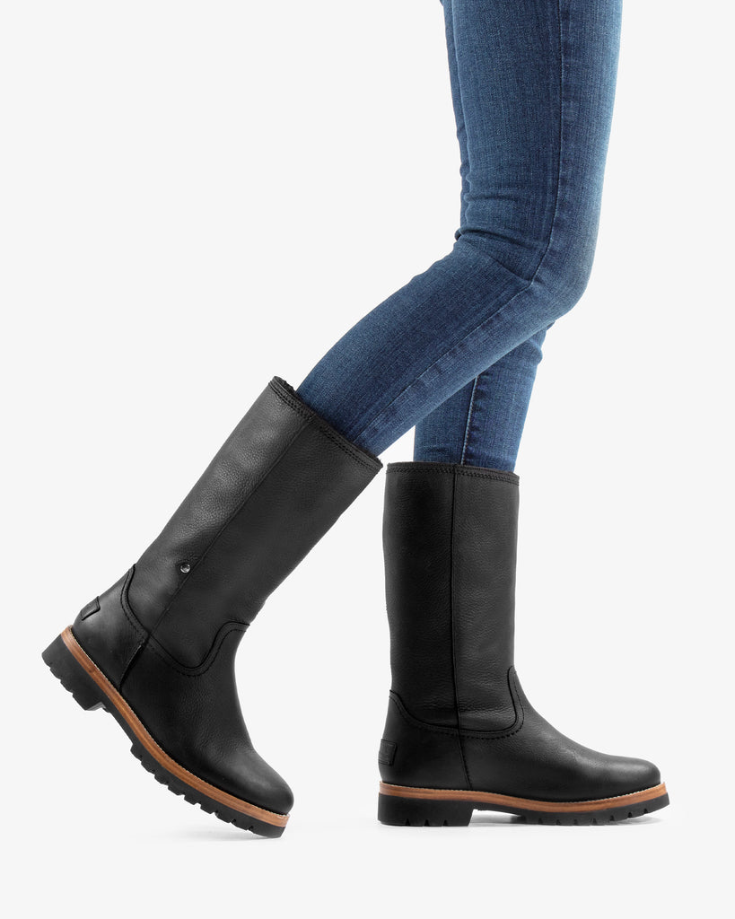 Bambina botas de piel con forro interior de pelo. negro